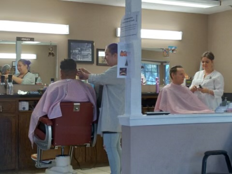 Man In Barber's Chair, Hairdresser Styling His Hair